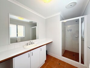 Shower, hair dryer, towels, shampoo