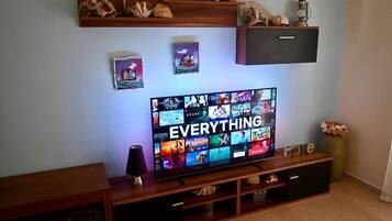 Apartment (Two Bedroom Apartment with Balcony) | Living room | 32-inch flat-screen TV with satellite channels