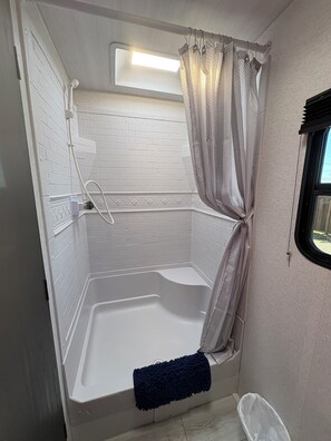 Shower, hair dryer, towels, soap
