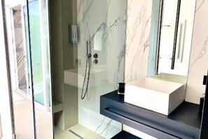 Shower, free toiletries, hair dryer, slippers