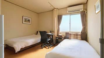Twin Room, Smoking, Shared Bathroom | Down comforters, free WiFi, bed sheets