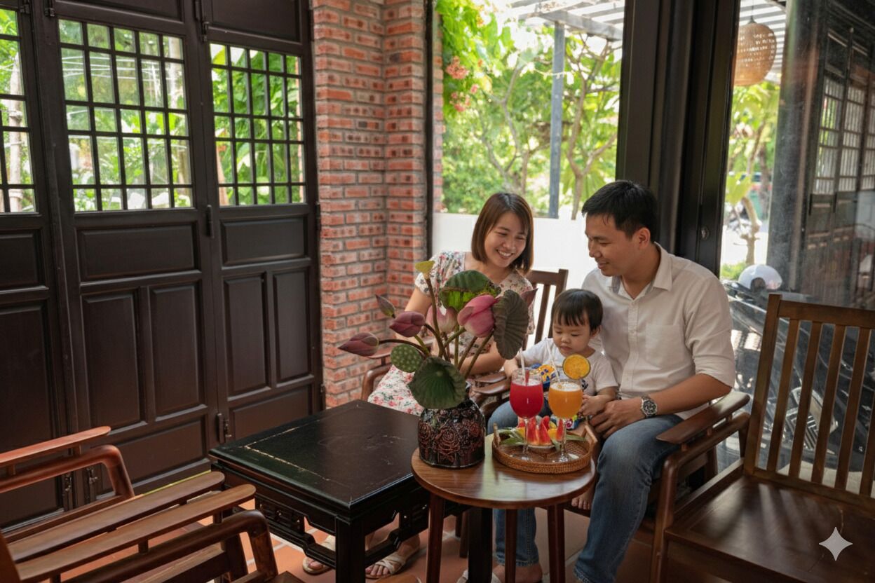 A family dining at a table with a brick wall and large windows in the background.