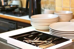 Apartment | Private kitchen | Full-size fridge, microwave, stovetop, cookware/dishes/utensils