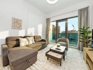 TV - Luxury 2BR near Burj Khalifa with Rooftop Pool, City & Canal Views, Free Parking (Dubai)