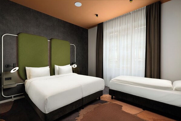 Deluxe Room (1 Double Bed and 1 Single Bed) | Desk, laptop workspace, blackout curtains, soundproofing
