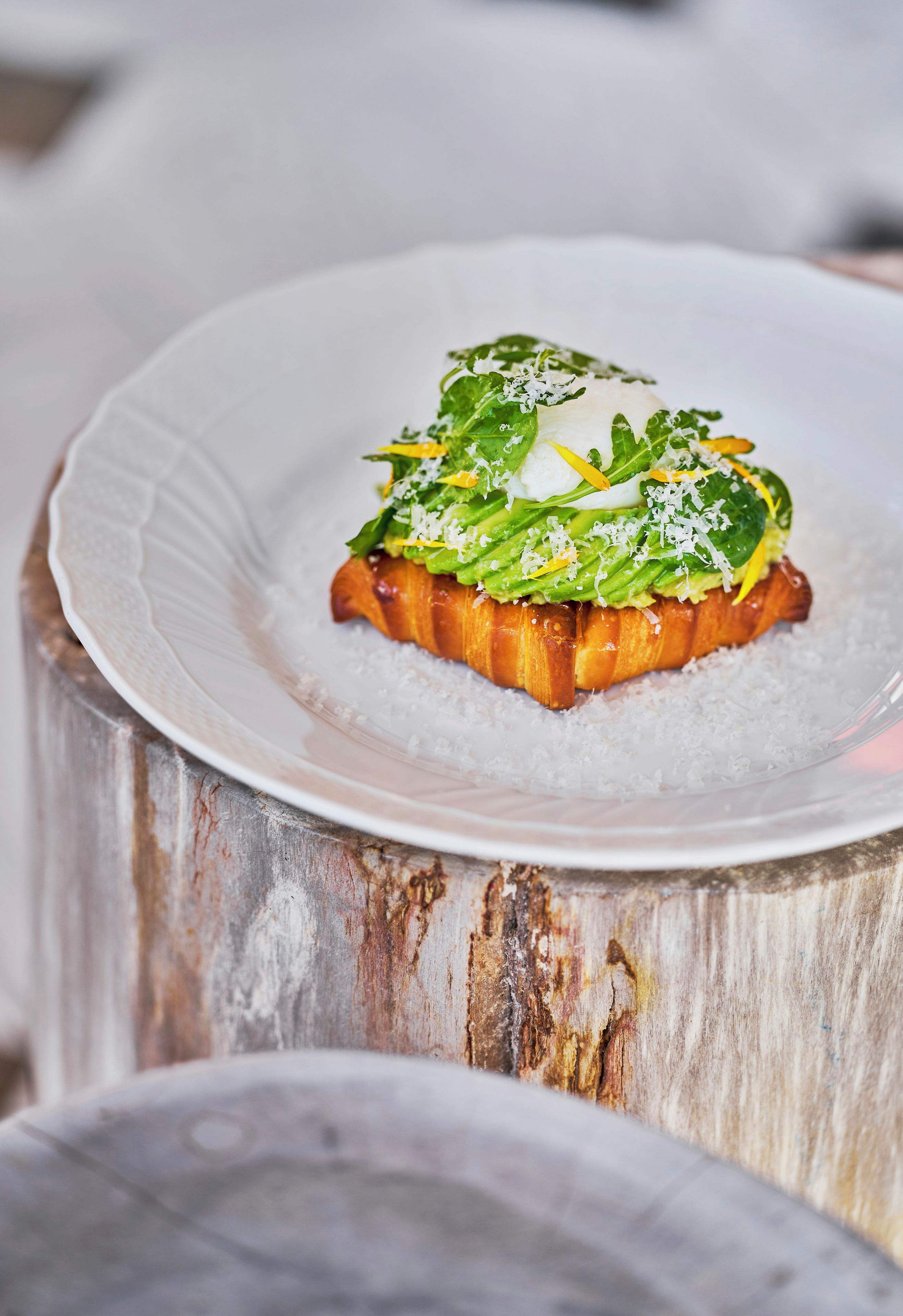 A dish on a white plate with a rustic wooden background.