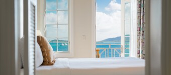 Balcony Room with Sweeping Ocean Views & Direct Access to Sandy Beach