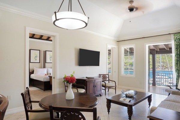 Relax together in the bright sitting area opening to the balcony.