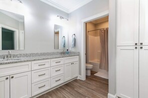 Shower, hair dryer, towels, toilet paper
