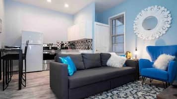 Jungle Bliss | Living area | 55-inch Smart TV with digital channels, Netflix, Hulu