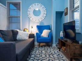 Jungle Bliss | Living area | 55-inch Smart TV with digital channels, Netflix, Hulu