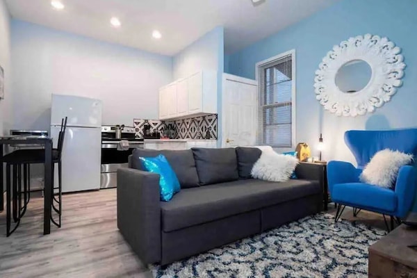 Jungle Bliss | Living area | 55-inch Smart TV with digital channels, Netflix, Hulu