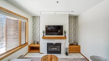 Relaxing Fireplace & TV Area - Settle into the inviting living room with a gas fireplace, large TV, and comfortable seating after a day on the mountain.