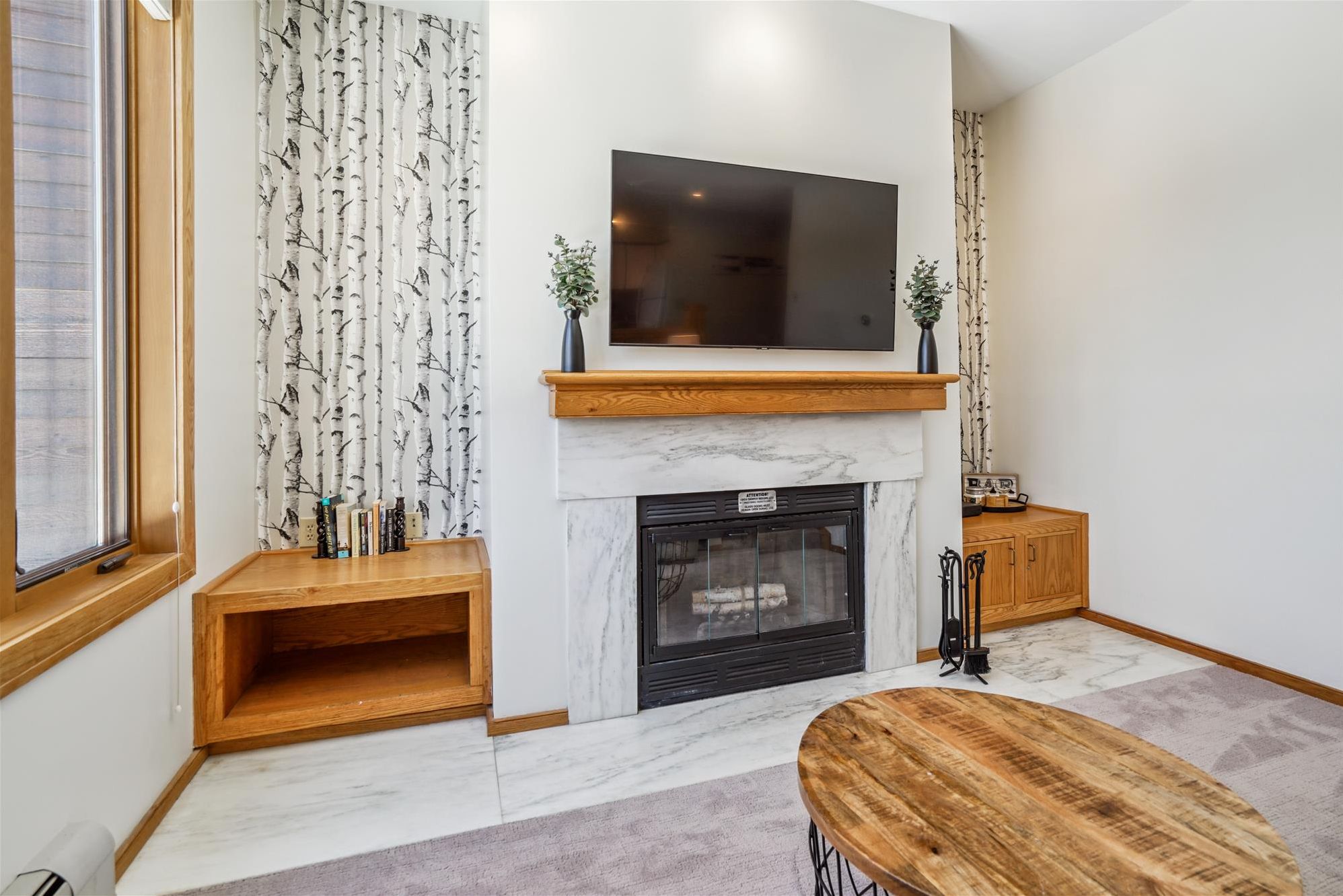 Relaxing Fireplace & TV Area - Kick back with your favorite movie beside the fireplace after skiing, hiking, or exploring Killington.
