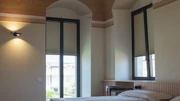 Deluxe Double or Twin Room, 4 Bedrooms, Balcony, Courtyard View | Minibar, in-room safe, desk, blackout drapes