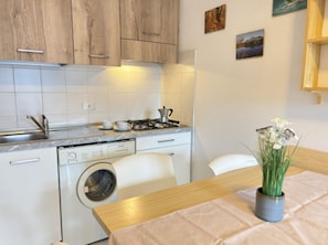 Fridge, microwave, stovetop, cookware/dishes/utensils