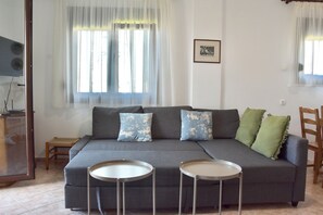 บ้านพัก, 2 ห้องนอน, ระเบียง, วิวทะเล | ห้องนั่งเล่น
