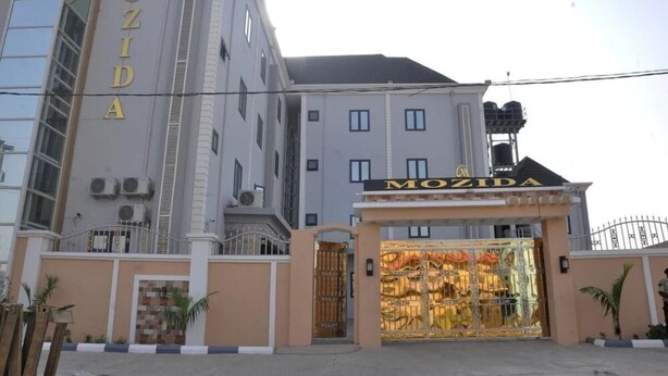 A building with a prominent sign reading "MOZIDA." - Mozida Suites  (Kano)