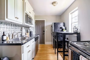 Exclusive Apartment, Patio | Private kitchen | Full-size fridge, microwave, oven, dishwasher