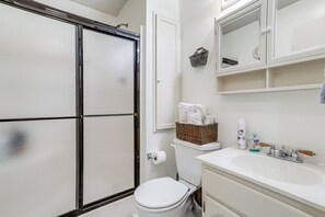 A bathroom with a shower, toilet, and sink. - 5 Mi to Downtown Morgan City: Waterfront Retreat (Morgan City)