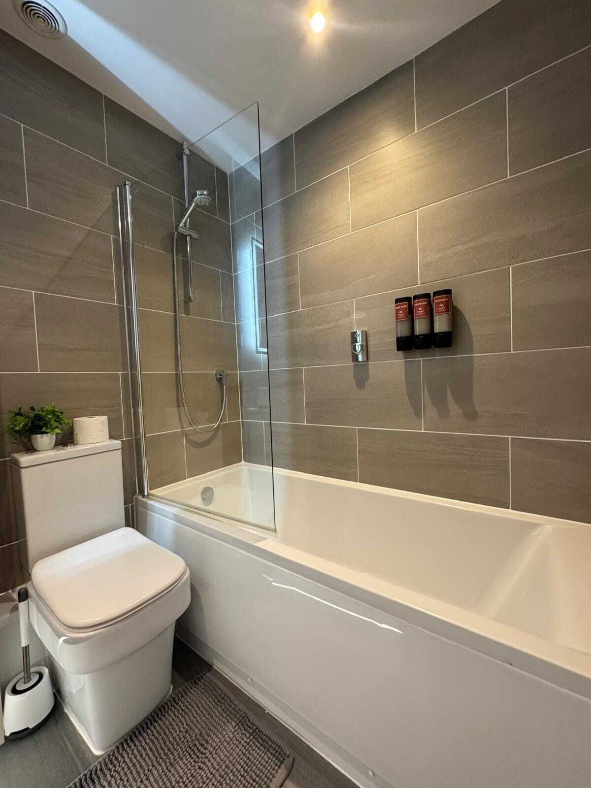 Shower, hair dryer, towels, shampoo