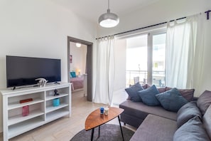 Appartement Confort, vue piscine | Salle de séjour