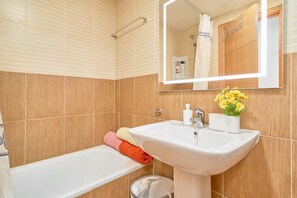 Shower, hair dryer, towels
