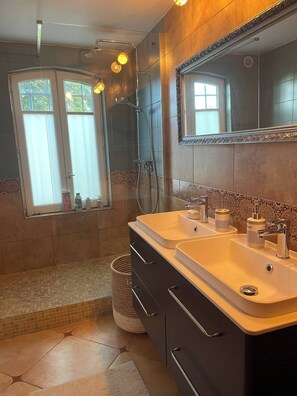 Shower, hair dryer, towels, toilet paper