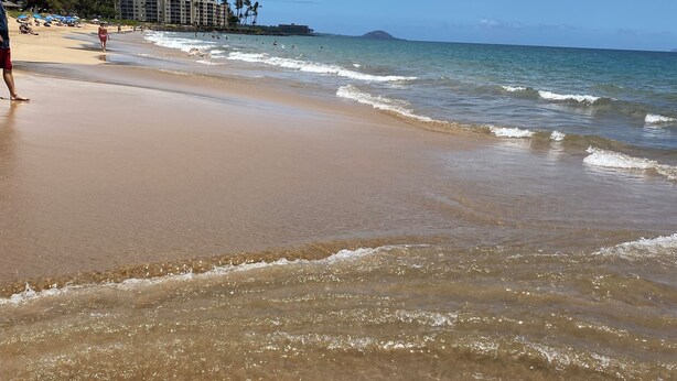 A beach with clear skies and calm waters. -  across from Charley Young  beach #2 (Kihei)