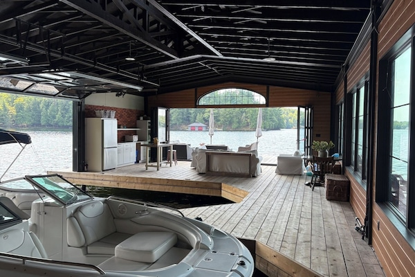 Inside boathouse facing dock, looking out over beautiful lake Rosseau.