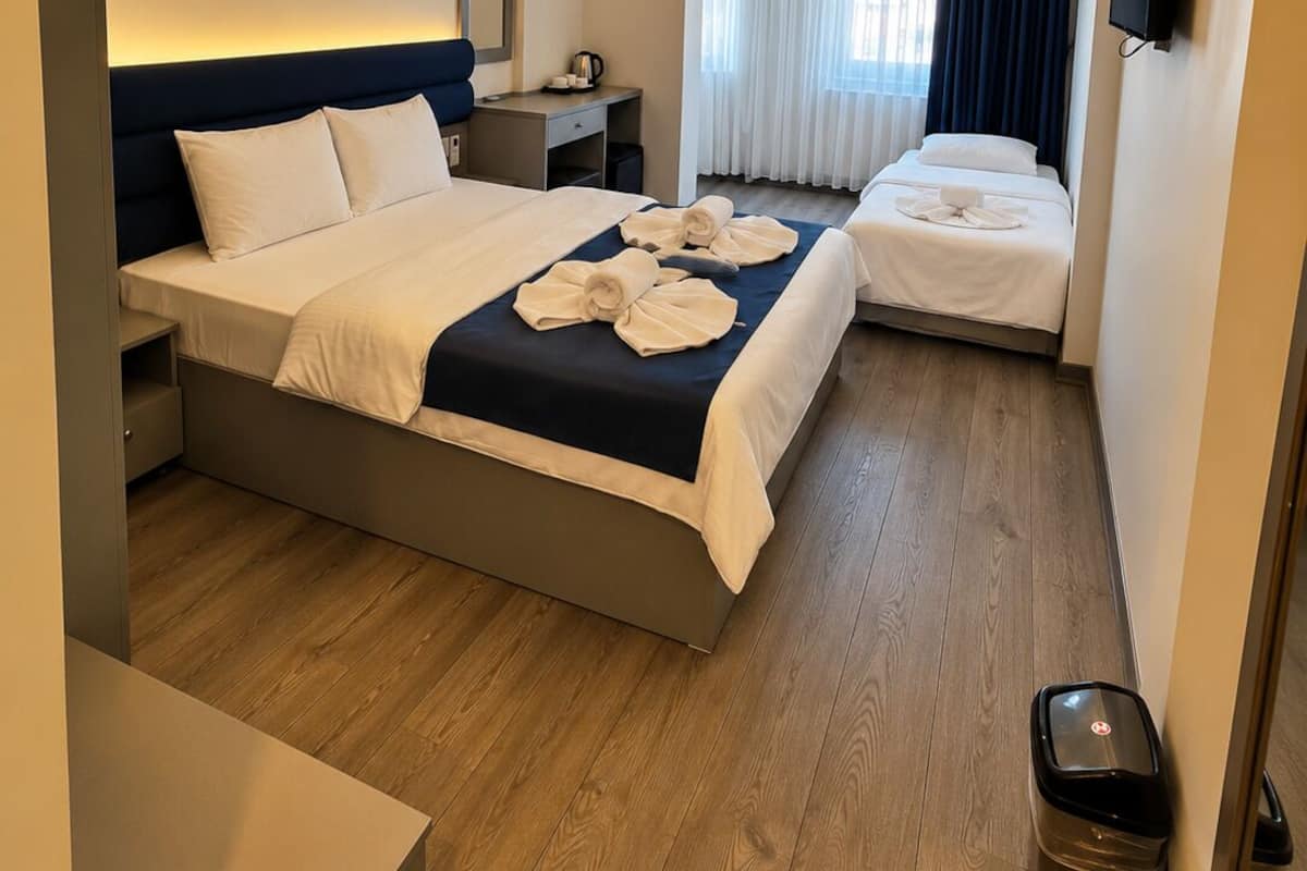 Deluxe Triple Room | Minibar, desk, laptop workspace, soundproofing