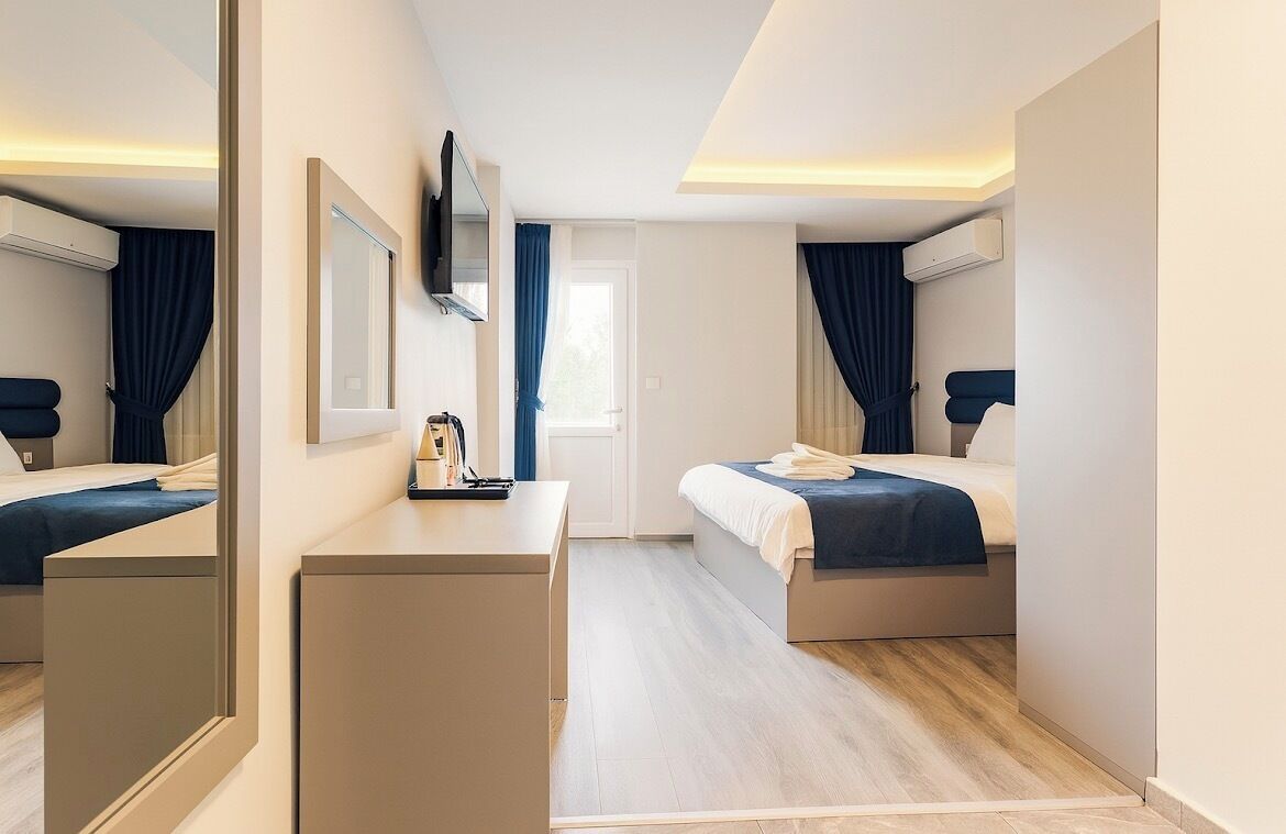 Deluxe Double Room, Balcony, Garden View | Minibar, desk, laptop workspace, soundproofing