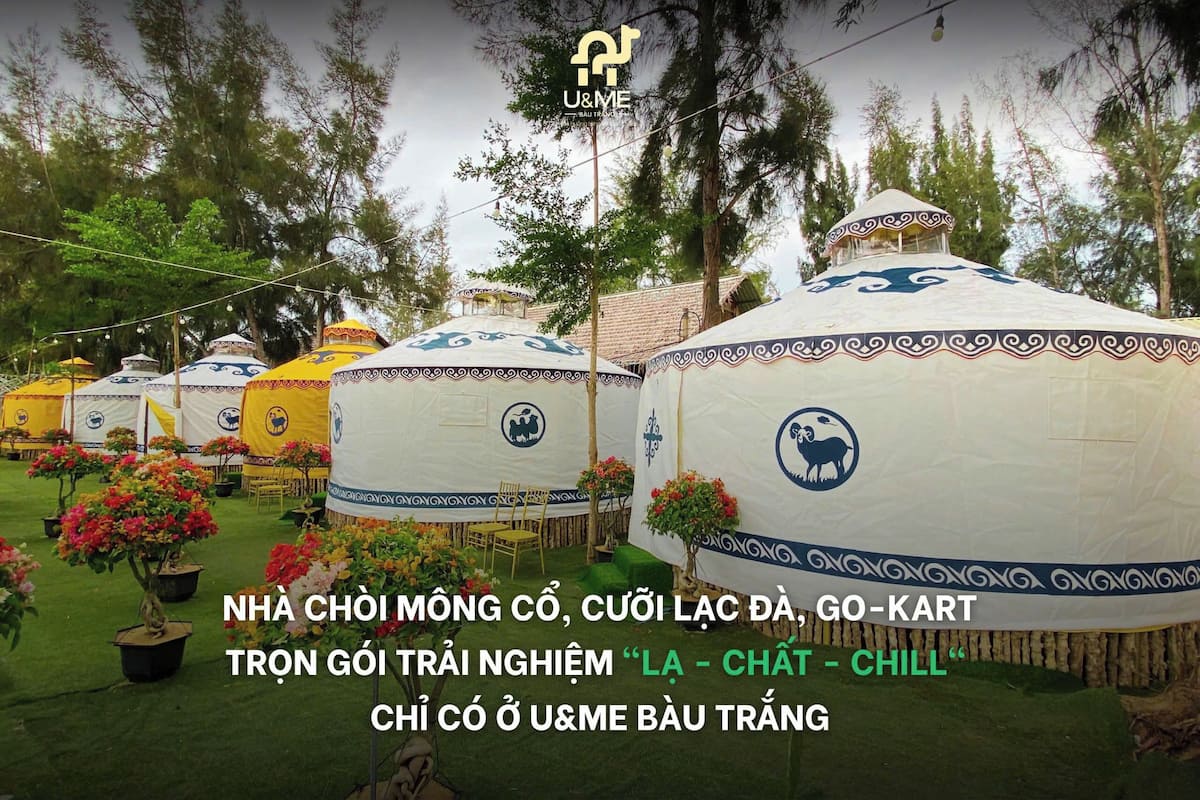 Yurts with a logo, surrounded by greenery and potted plants.