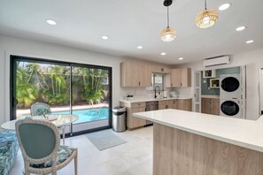 Fridge, microwave, oven, stovetop - West Palm Beach Oasis | Private Pool Retreat & Open Air Lounge | King Bed & 2 Queen Beds | Grill | TheLiliPad (West Palm Beach)