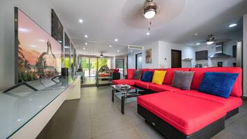 Deluxe Condo, Patio | Living area