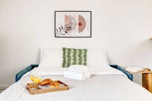 1 bedroom, desk, iron/ironing board, travel crib