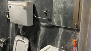 A bathroom with a toilet, bidet, and sink. - De Soul Santé Pawna (Mawal)