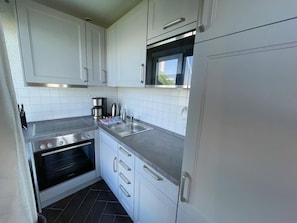 Fridge, microwave, dishwasher, coffee/tea maker