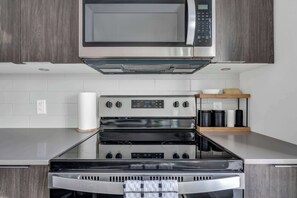 Fridge, microwave, oven, stovetop - The Cowboy Downtown Calgary Central Condo (Calgary)