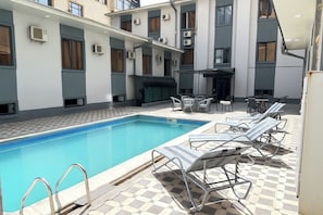 Outdoor pool, pool umbrellas, pool loungers