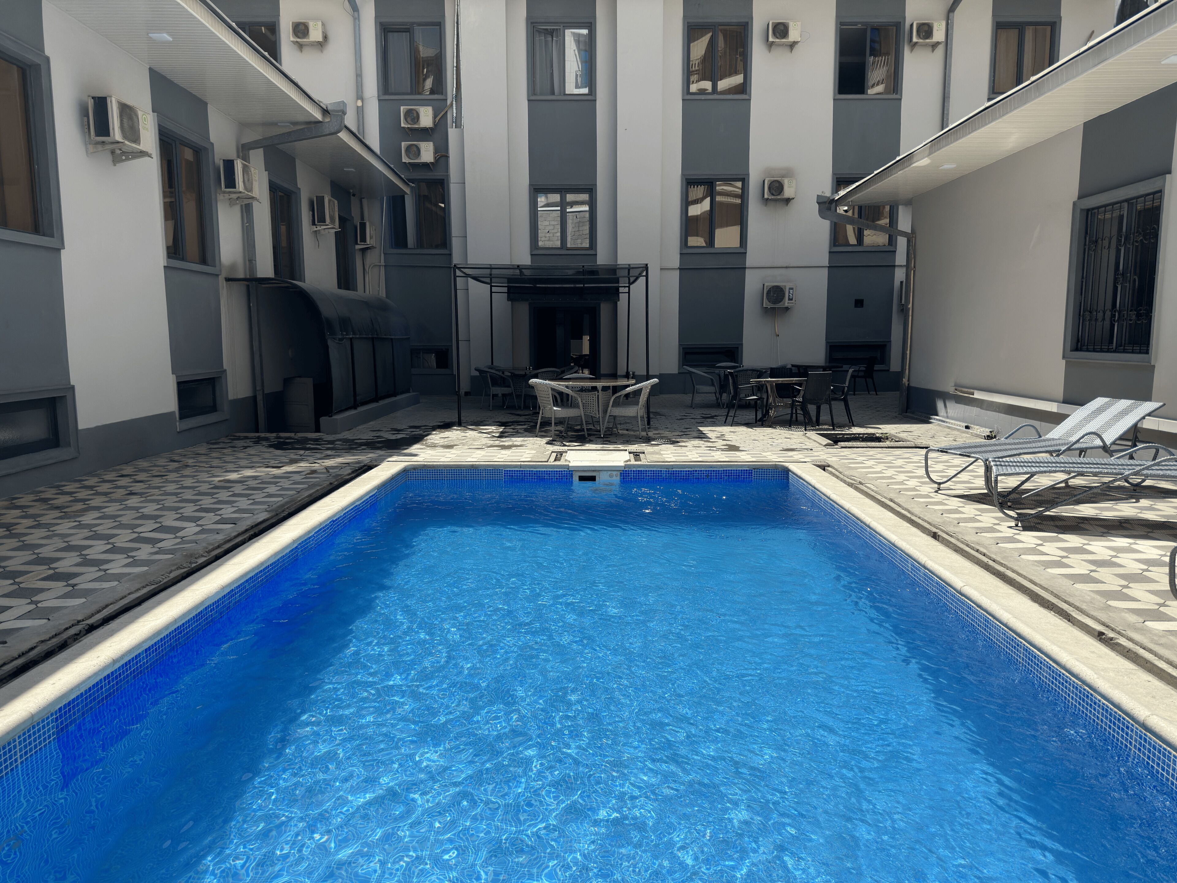 Outdoor pool, pool umbrellas, pool loungers