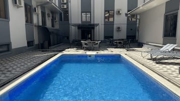 Outdoor pool, pool umbrellas, pool loungers