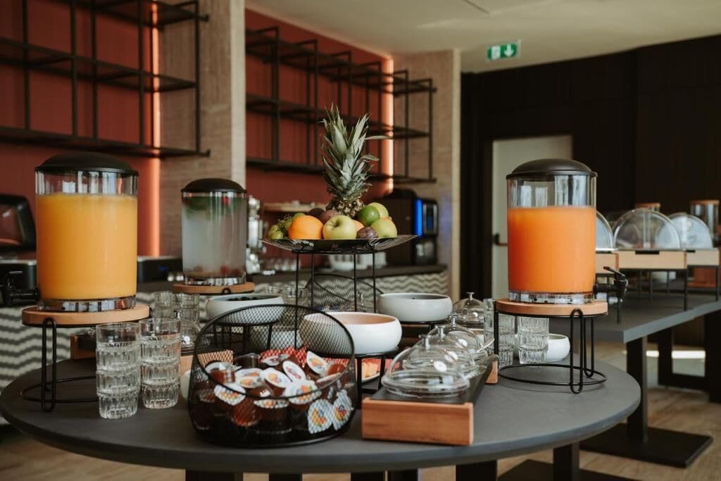 A breakfast buffet with various food items and beverages.