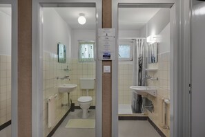 Shower, hair dryer, towels, toilet paper