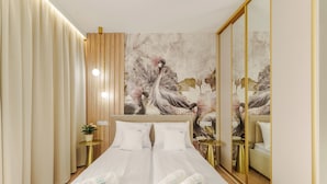Apartemen Deluks, AC | Seprai premium, setrika/meja setrika, Wi-Fi gratis, dan seprai linen