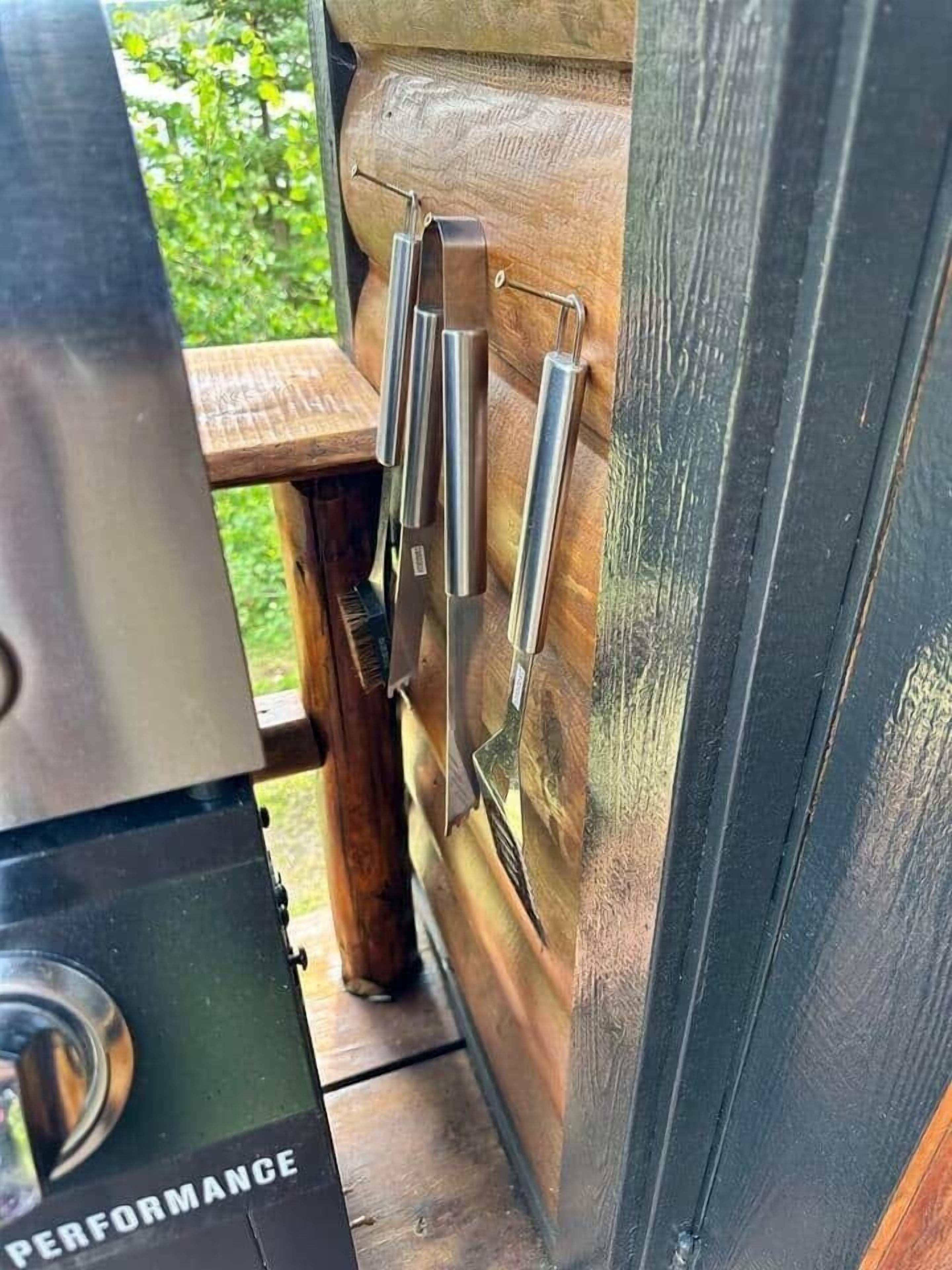 A wooden door with metal handles and a grill unit with a 'PERFORMANCE' label.