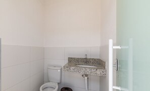 A bathroom with a toilet, sink, and shower. - Comfortable Home With Great Location! Bmr0004 (Porto Seguro)