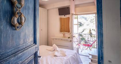 House in the mountains near the sea