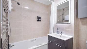 Shower, hair dryer, towels, shampoo