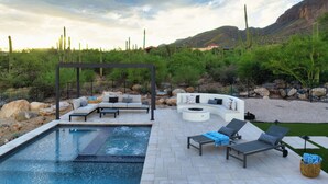 A pool area with lounge chairs, a seating area, and a pergola. - Catalina Dreamin' Luxe Foothills Oasis w/Pool! (Tucson)